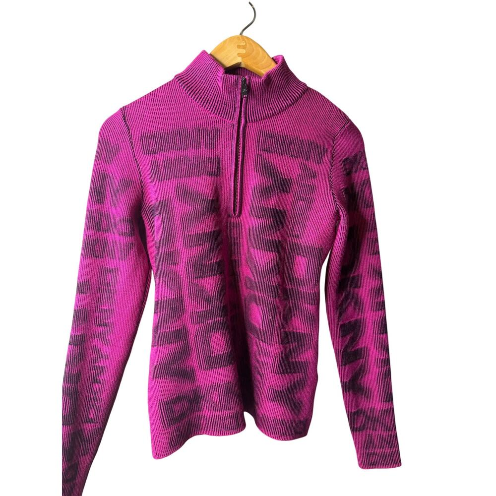 vibrant magenta and black DKNY knit sweater with a bold allover logo pattern.